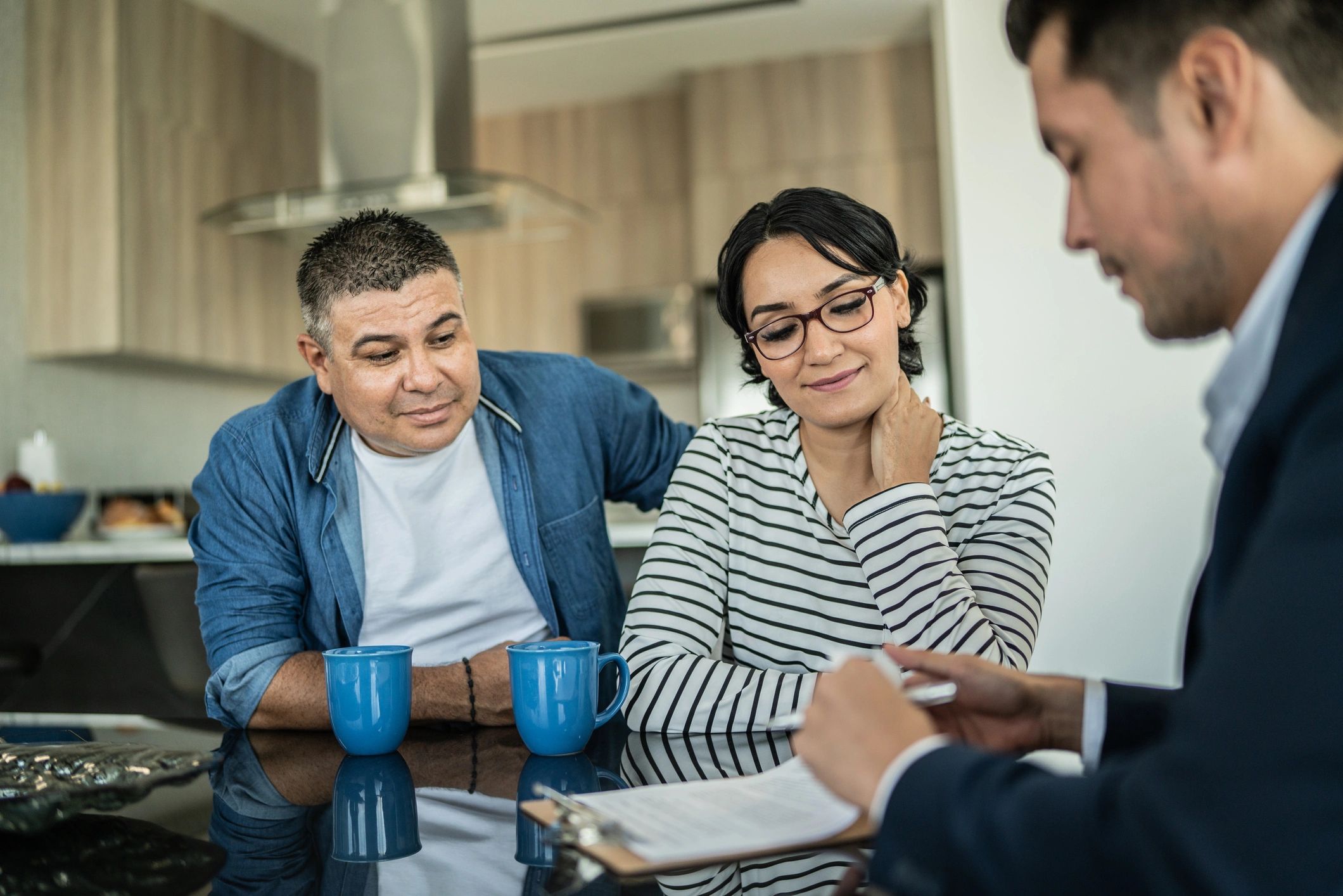 Happy couple meeting with an advisor